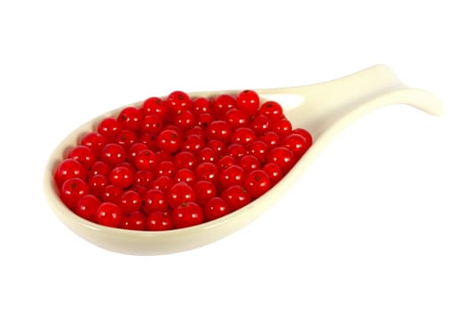Red currants in a scoop isolated on white
