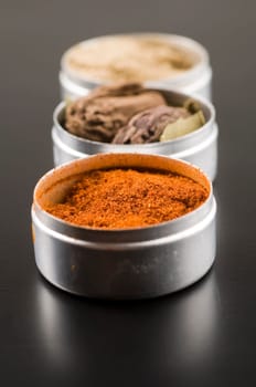 Indian Spices on Black Table.