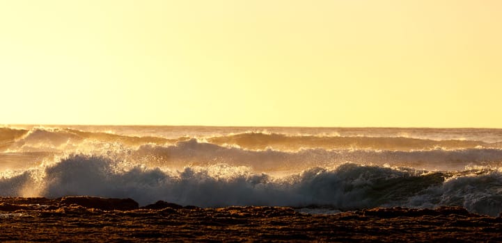 Waves crashing on reef of coast of Kauai off Kee beach