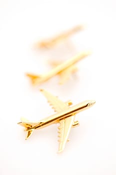Three Golden Planes, Isolated on a White Background.