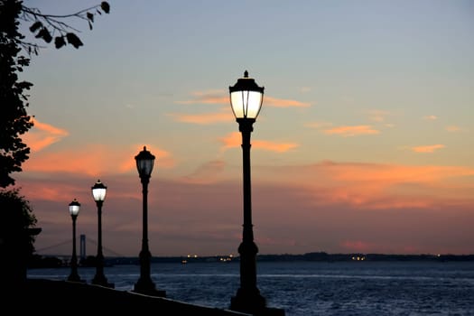 Beachfront in New York with lanterns at sunset