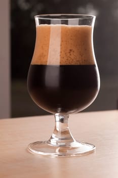 Stout Beer on Wooden Table.
