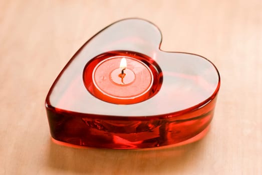 red heart with candle close up shoot