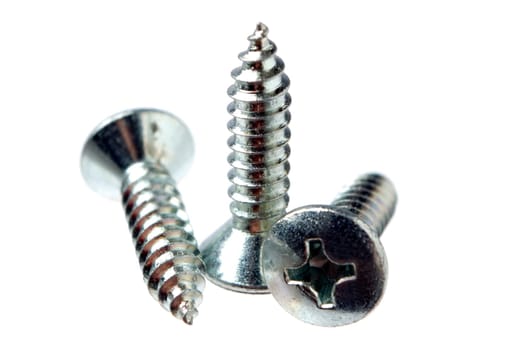 Three screws on white background close up shoot