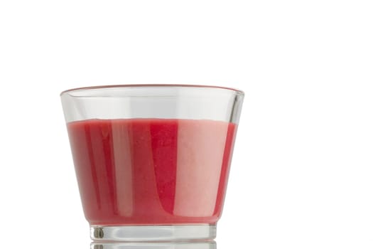 An almost full glass of smoothie