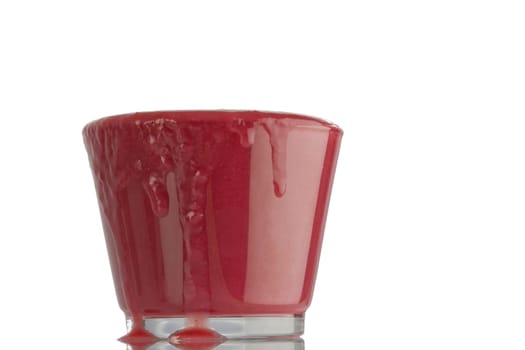 An overflowing glass of smoothie