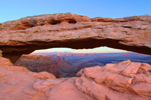 Mesa Arch of Canyonlands National Park under soft evening light.