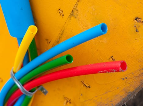cable on cable drum containing four cables in different colors