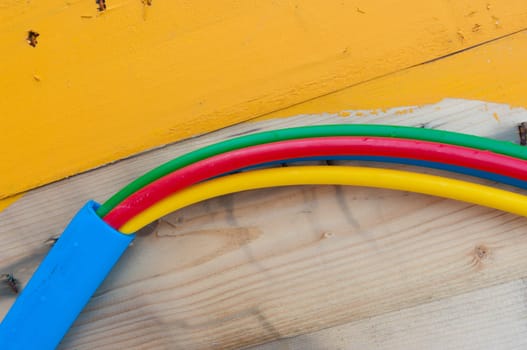 cable on cable drum containing four cables in different colors