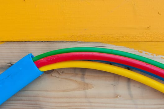 cable on cable drum containing four cables in different colors
