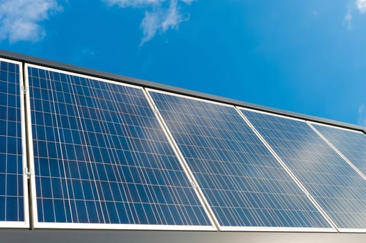 solar panels against a blue sunny sky