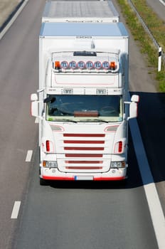 large truck coming head-on, elevated view from above, close-ups