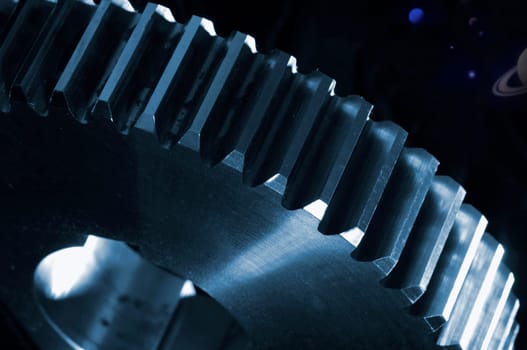 giant titanium gear wheel set against black