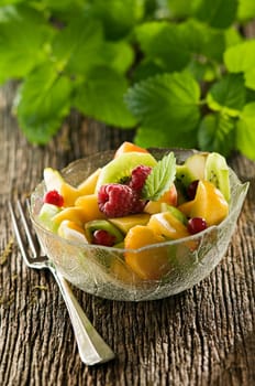 Fresh fruit with in glass bowl close up