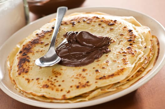 Fresh pancakes with chocolate close up shoot