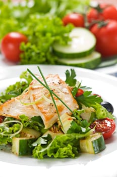 Chicken salad with lettuce and vegetables close up