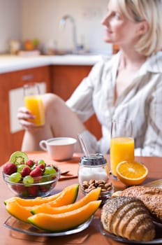 Fresh healthy breakfast with young girl in background
