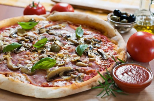 Fresh pizza on wooden board close up shoot