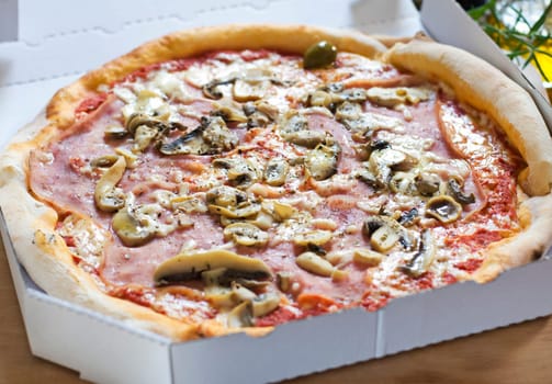 Fresh pizza in a box close up shoot