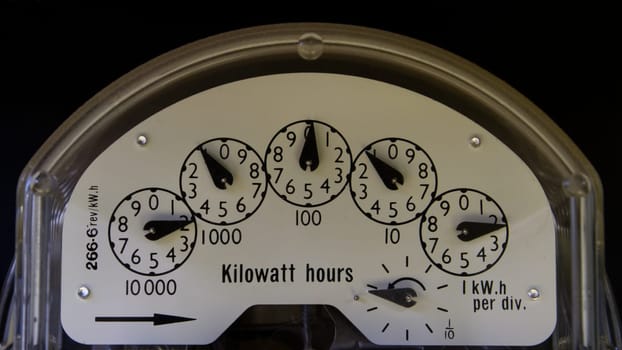 An older style electricity meter from a house meter box.