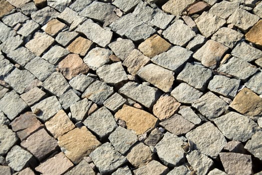 Diagonal pattern of layered, unevenly dressed, stone wall