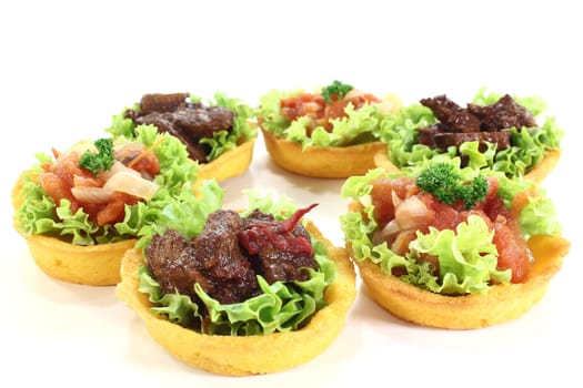 Corn tartlet with salad and various fillings