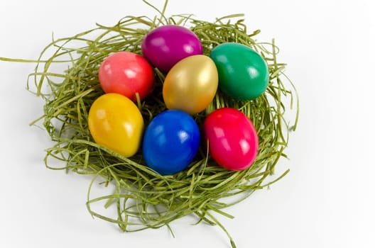 Colorful Easter eggs in the grass