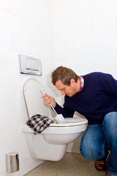 Man cleaning toilet
