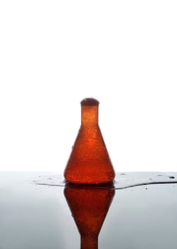 Laboratory Glass with orange liquid