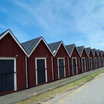 Row of boathouses on a sunny day