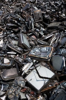 Stack of Metal Garbage in front of blue sky