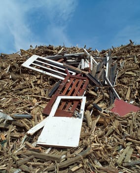 Heap of Wood Garbage in front of blue sky