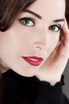 Close-up portrait of a beautiful middle aged woman with beautiful red lips