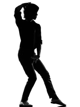full length silhouette of a young man dancer dancing funky hip hop r&amp b on  isolated  studio white background