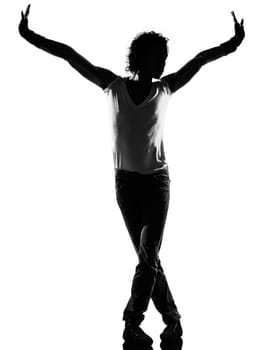 full length silhouette of a young man dancer dancing funky hip hop r&amp b on  isolated  studio white background