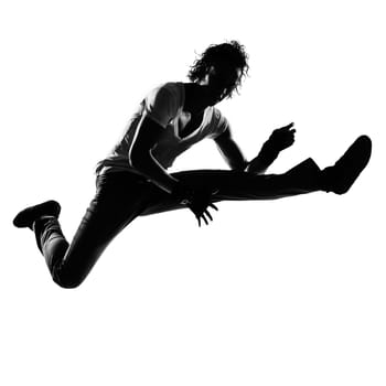 full length silhouette of a young man dancer dancing funky hip hop r&amp b on  isolated  studio white background