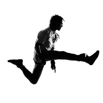 full length silhouette of a young man dancer dancing funky hip hop r&amp b on  isolated  studio white background