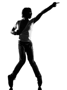 full length silhouette of a young man dancer dancing funky hip hop r&amp b on  isolated  studio white background