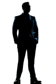 one caucasian  business man  handsome full suit standing full length serious silhouette in studio isolated white background