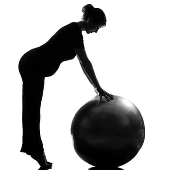 beautiful caucasian pregnant woman exercising fitness workut pilates with fitness ball in full length silhouette on studio isolated white background