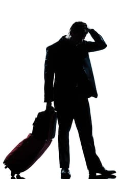 one caucasian man full length silhouette in studio isolated white background