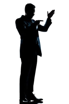 one caucasian man friendly menacing full length silhouette in studio isolated white background