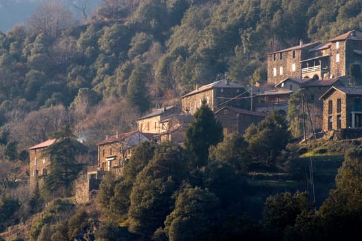 landscape of the Cevennes, detached houses in the mountain.