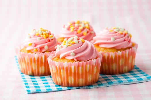 Close-up of delicious pink muffins. Studio shot.
