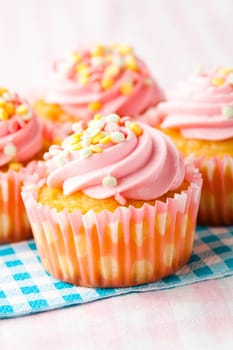 Close-up of delicious pink muffins. Studio shot.
