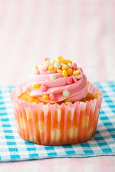Close-up of delicious pink muffin. Studio shot.