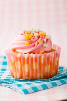 Close-up of delicious pink muffin. Studio shot.