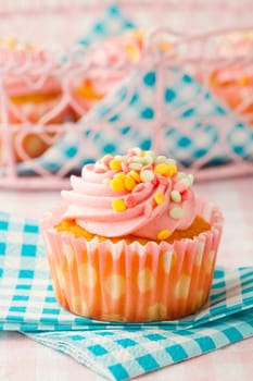 Close-up of delicious pink muffin. Studio shot.