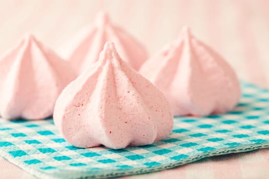 Close-up of delicious pink meringue. Studio shot.