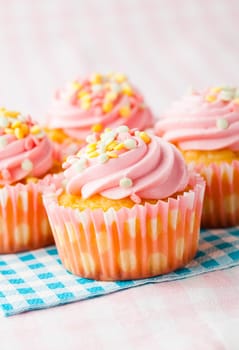 Close-up of delicious pink muffins. Studio shot.